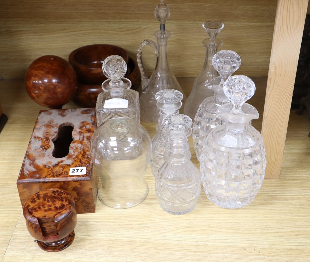 A quantity of cut glass decanters and treen